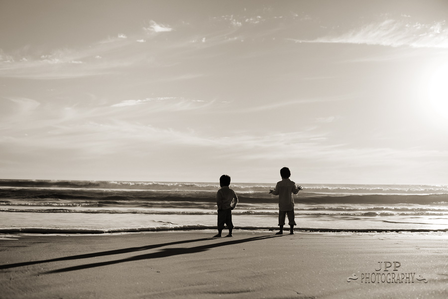 Timeless feel lifestyle photo of 2 kids on the beach in Huntington